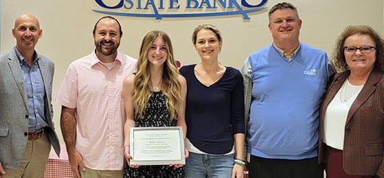 Scholarship Winner Baili Renie Accepting Award with her Family and #TeamCSB