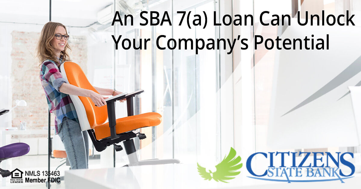 Businesswoman Moving into a New Office due to Funds from an SBA Loan