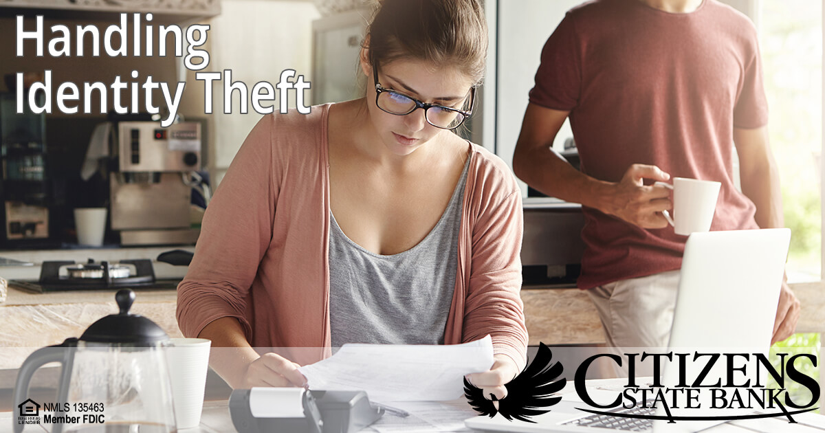 Woman at desk reviewing at documents