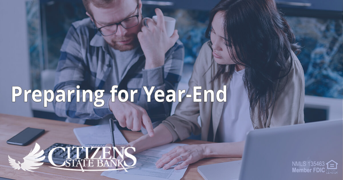 man and woman reviewing financial statement together