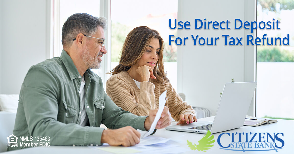 photo of couple looking at paperwork - Use Direct Deposit for your Tax Refund